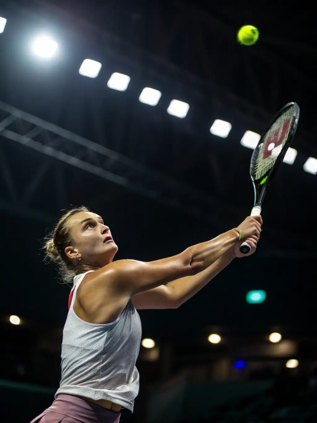A tennis player in a Vyonic academy, undergoing a strength and conditioning session tailored to improve serve power and court mobility, emphasizing the physical aspect of training.